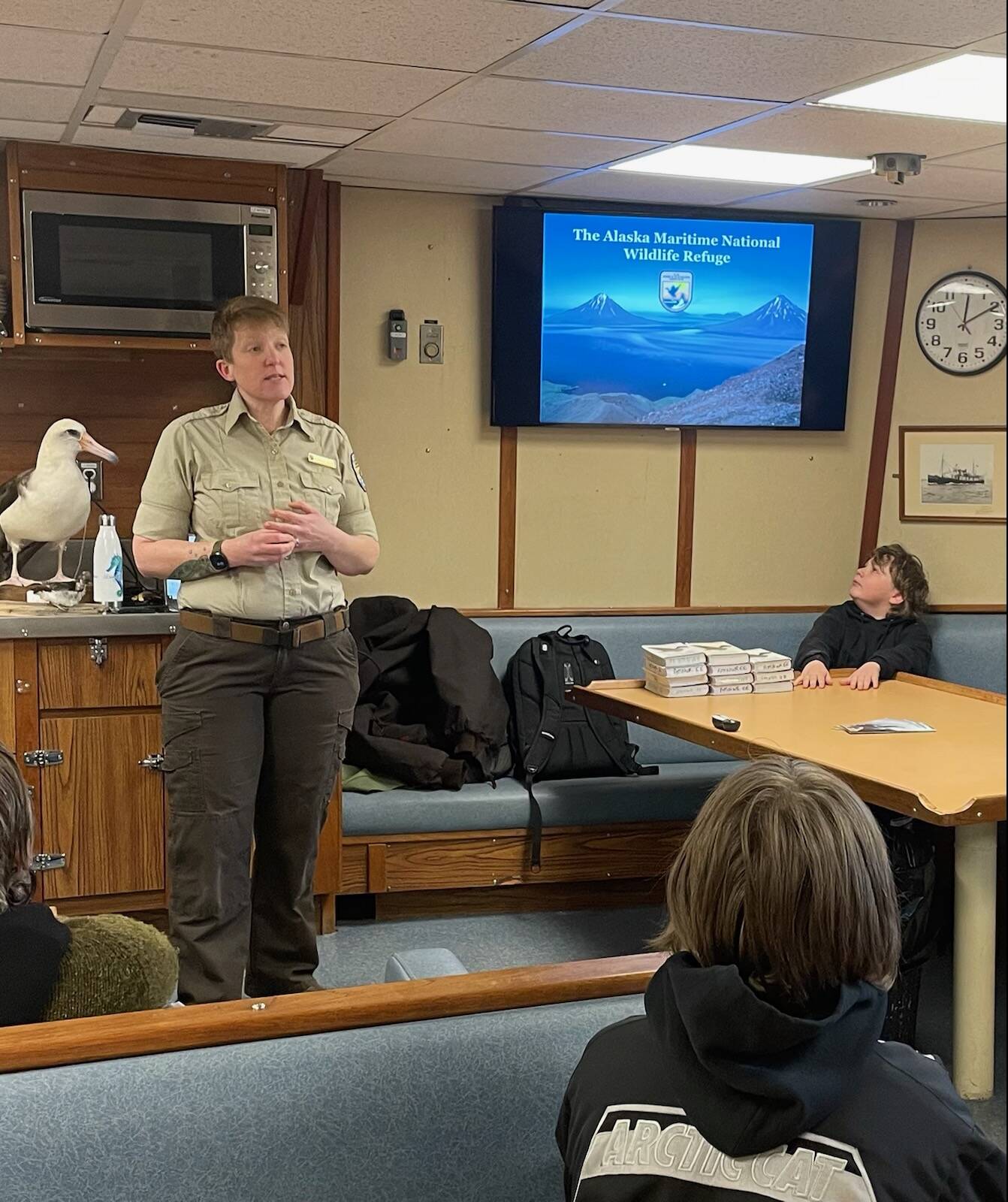 Kendra Bush introduces the Alaska Maritime National Wildlife Refuge to Fireweed students onboard the R/V Tiglax in Homer on April 6. (Photo by Emilie Springer/ Homer News)