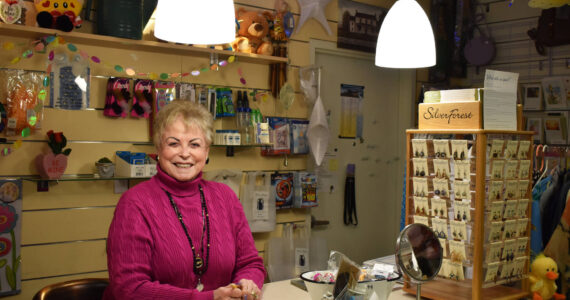 Donna Weeks volunteers at the Central Peninsula Hospital Gift Shop in Soldotna, Alaska, on Tuesday, April 11, 2023. (Jake Dye/Peninsula Clarion)