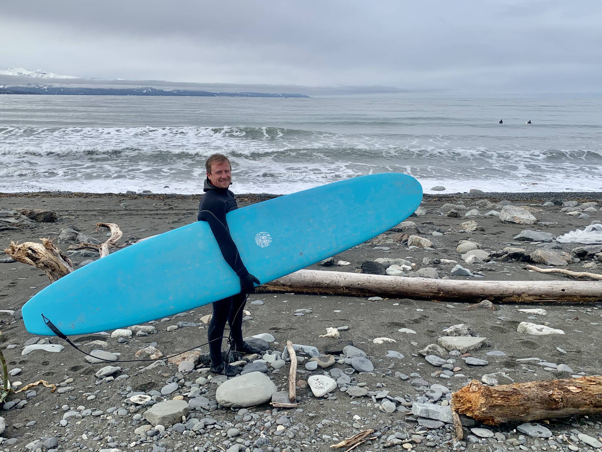 Johnny Sheffler prepares to hit the waves on the Homer Spit on Saturday<ins>, April 15, 2023 in Homer, Alaska</ins>. (Photo by Christina Whiting)