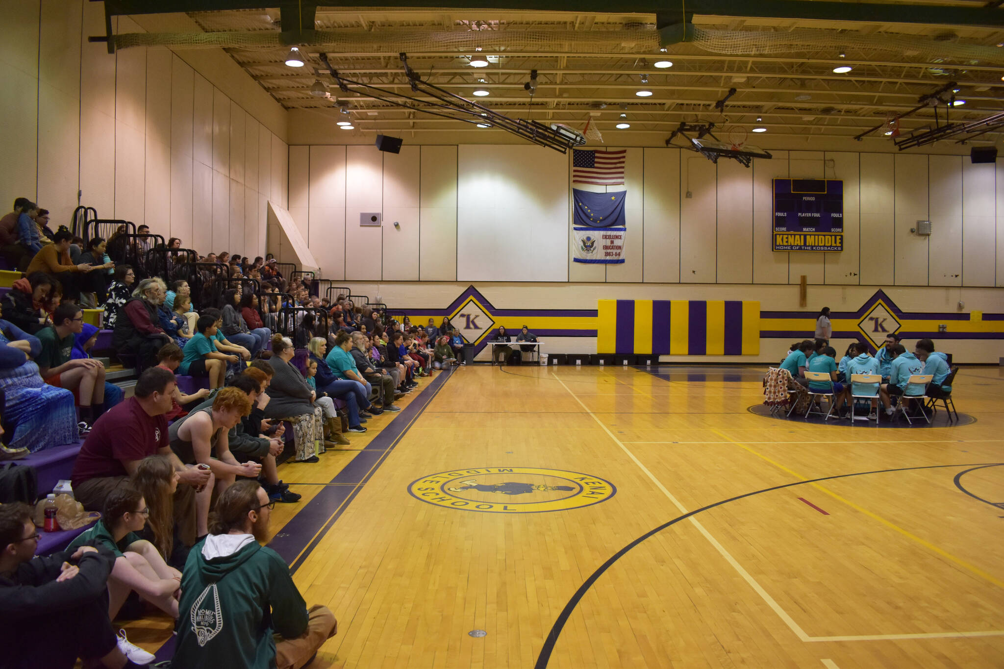 Packed stands watch traditional drumming during the opening ceremony of the Salamatof Tribe Traditional Native Games Invitational at Kenai Middle School in Kenai, Alaska, on Friday, April 14, 2023. (Jake Dye/Peninsula Clarion)