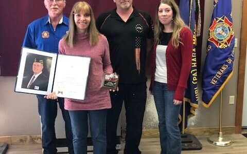 VFW Memorial Post 10221 presents “Teacher of the Year” award to Chapman School’s Bea Klaich on Saturday<ins>, April 22, 2023 in Anchor Point, Alaska</ins>. From left to right, Eric Henley, Bea Klaich, Chuck Collins, Mackenzie Henley. Photo provided by Jennifer Henley