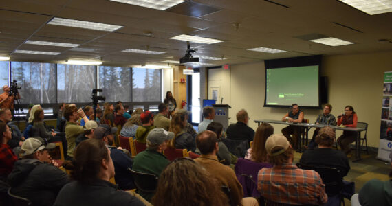 Cook Inletkeeper Science Director Sue Mauger speaks in front of a packed crowd during a panel discussion for the Kenai Peninsula College Showcase “State of the Salmon” on Wednesday, April 20, 2023, at KPC in Soldotna, Alaska. (Jake Dye/Peninsula Clarion)
