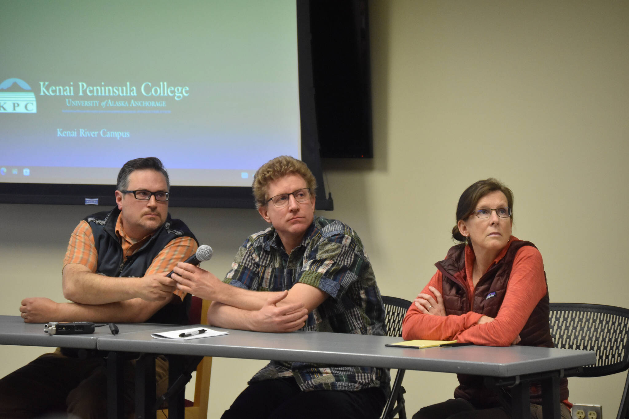 University of Alaska Fairbanks Associate Professor Dr. Peter Westley, Department of Fish and Game Biologist Adam Reimer, and Cook Inletkeeper Science Director Sue Mauger listen to a question during a panel discussion for the Kenai Peninsula College Showcase "State of the Salmon" on Wednesday, April 20, 2023, at KPC in Soldotna, Alaska. (Jake Dye/Peninsula Clarion)