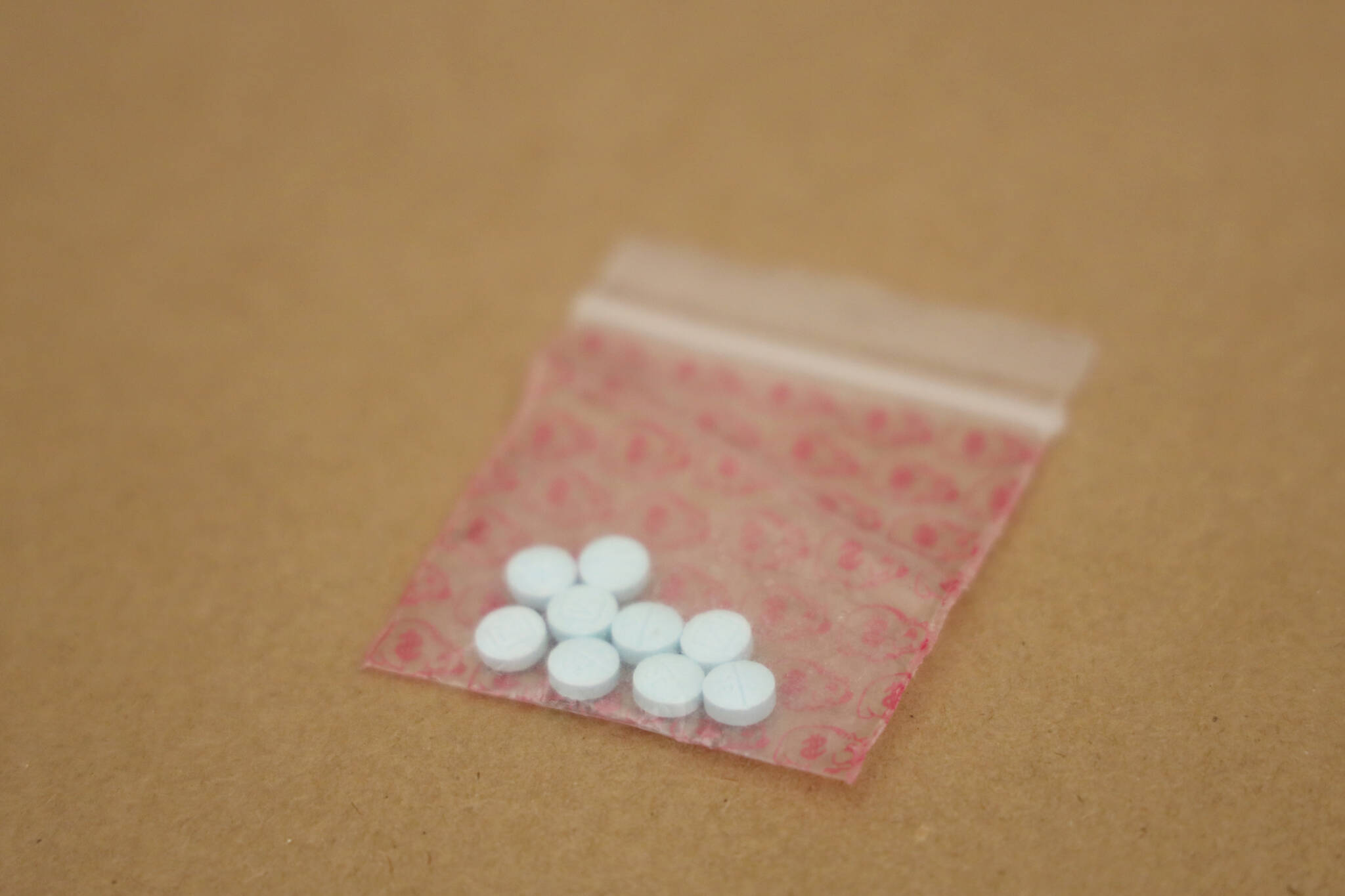 This March 10 photo shows fentanyl pills seized by police. (Clarise Larson / Juneau Empire File)
