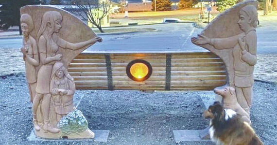 Photo by Art Koeninger/courtesy
The lotus lamp for the Loved and Lost Memorial Bench was lit April 26 in front of the Homer Public Library.
