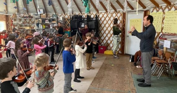 Little Fireweed students rehearse for A Sea of Strings concert with conductor Abimael Melendez at the Little Fireweed Yurt on Wednesday, April 29.  Emilie Springer/ Homer News