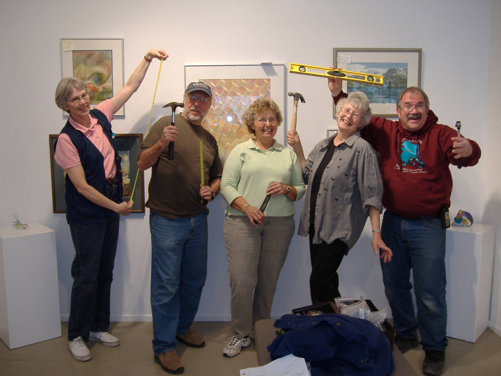 KBWS members hang a spring show at Fireweed Gallery in 2005. From left to right, Donna Martin, Tony Clawson, Pat Wells, founder Paula Dickey, and Michael Murray. Photo provided by Donna Martin