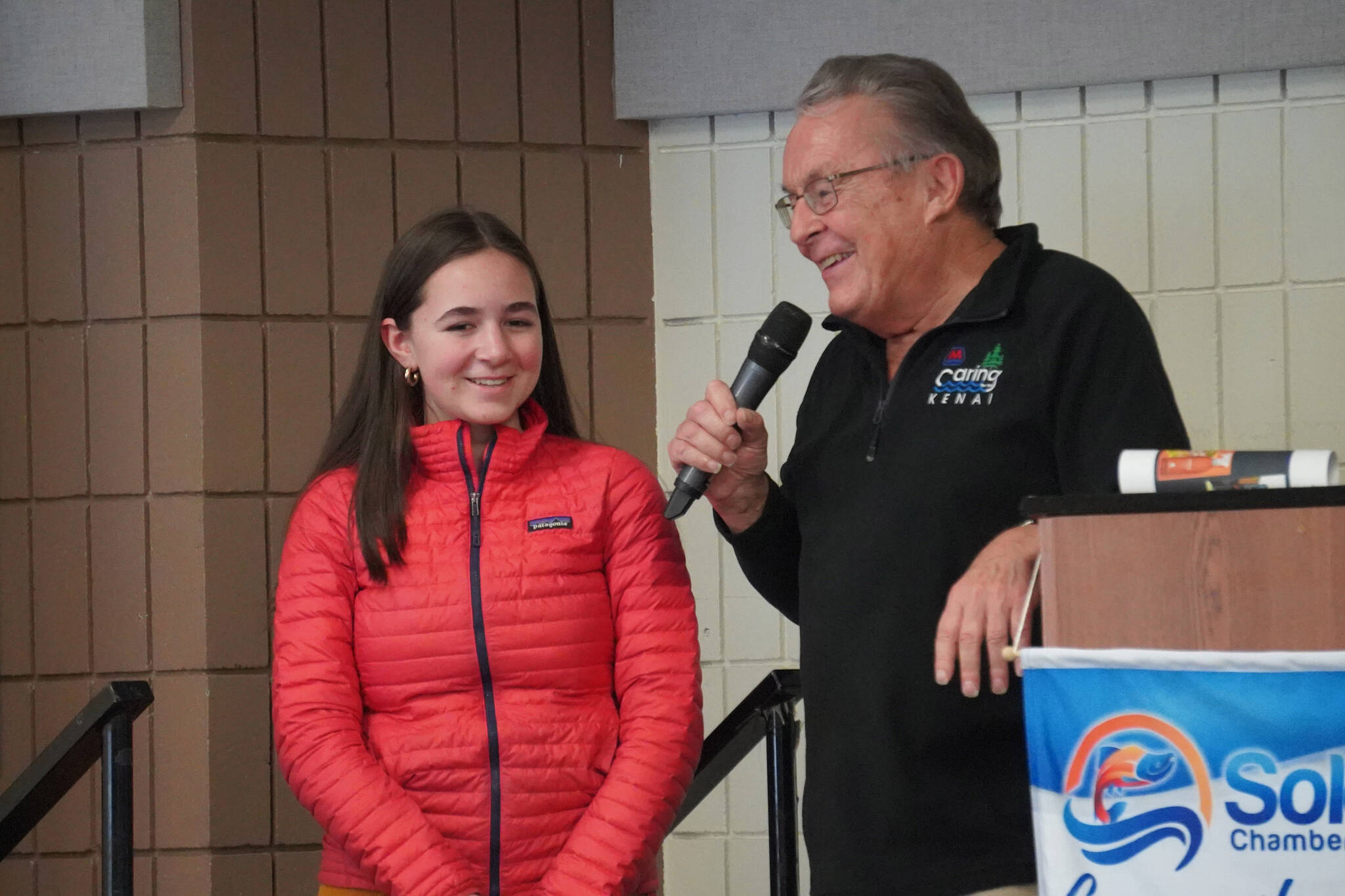 McKenna Black, of Homer High School, is introduced by Merrill Sikorski at the Caring for the Kenai Awards Celebration held during a Joint Chamber Luncheon on Wednesday, May 3, 2023, at the Soldotna Regional Sports Complex in Soldotna, Alaska. (Jake Dye/Peninsula Clarion)