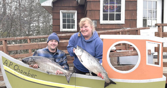 Jesse Pasch (left), winner of the average fish prize in the 28th annual Anchor Point King Salmon Tournament, poses with his fish during weigh-in on Saturday, May 6 at the Anchor Point Chamber of Commerce building in Anchor Point, Alaska. This is Pasch’s second year of winning “average fish.” Photo courtesy of Mcki Needham