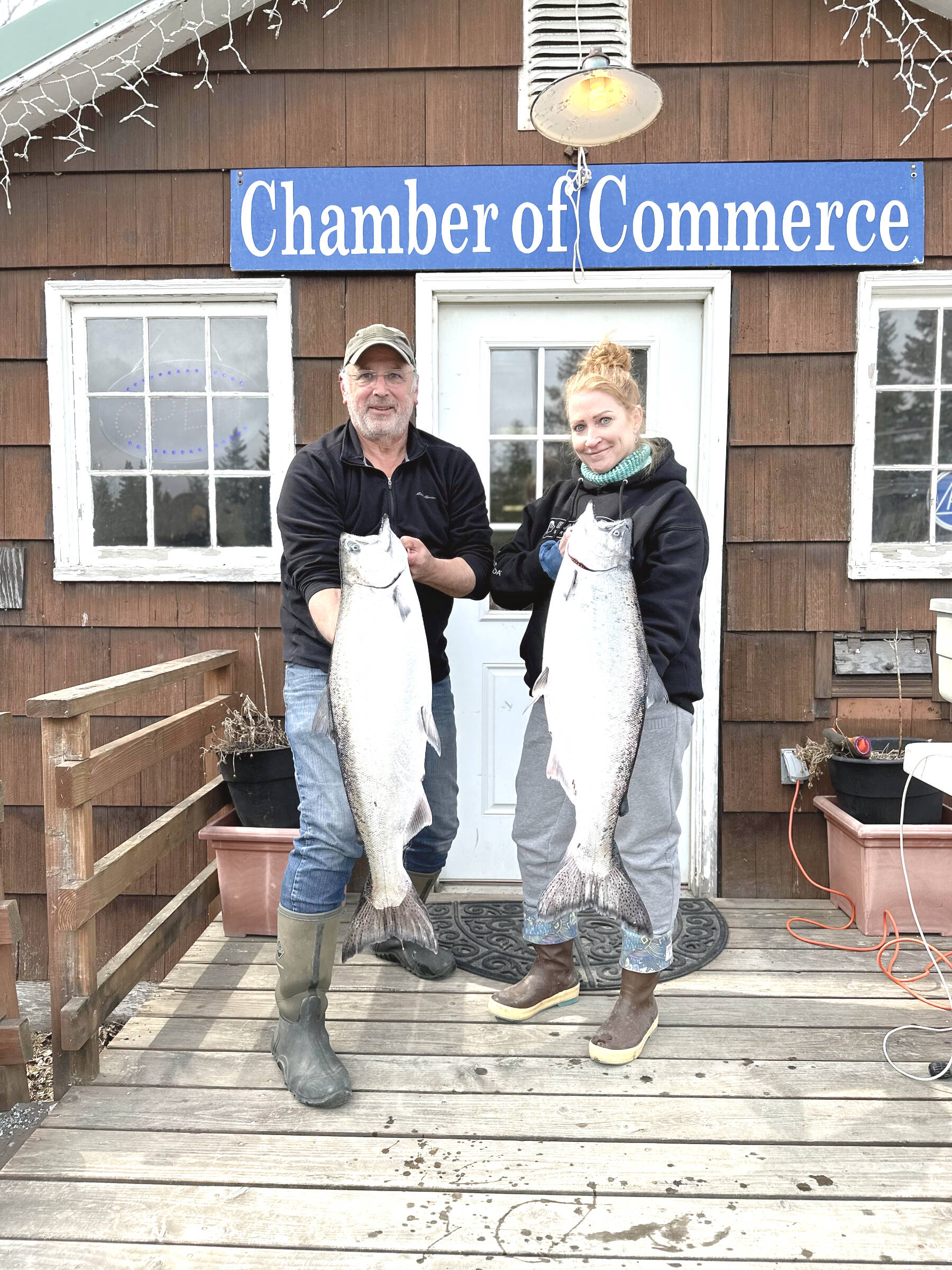 The 28th annual Anchor Point King Salmon Tournament first and second place winners, Judy Persnail (right) and Mark Tornai (left) from the boat Outlaw hold up their fish during weigh-in on Saturday, May 6 at the Anchor Point Chamber of Commerce building in Anchor Point, Alaska. Photo courtesy of Mcki Needham