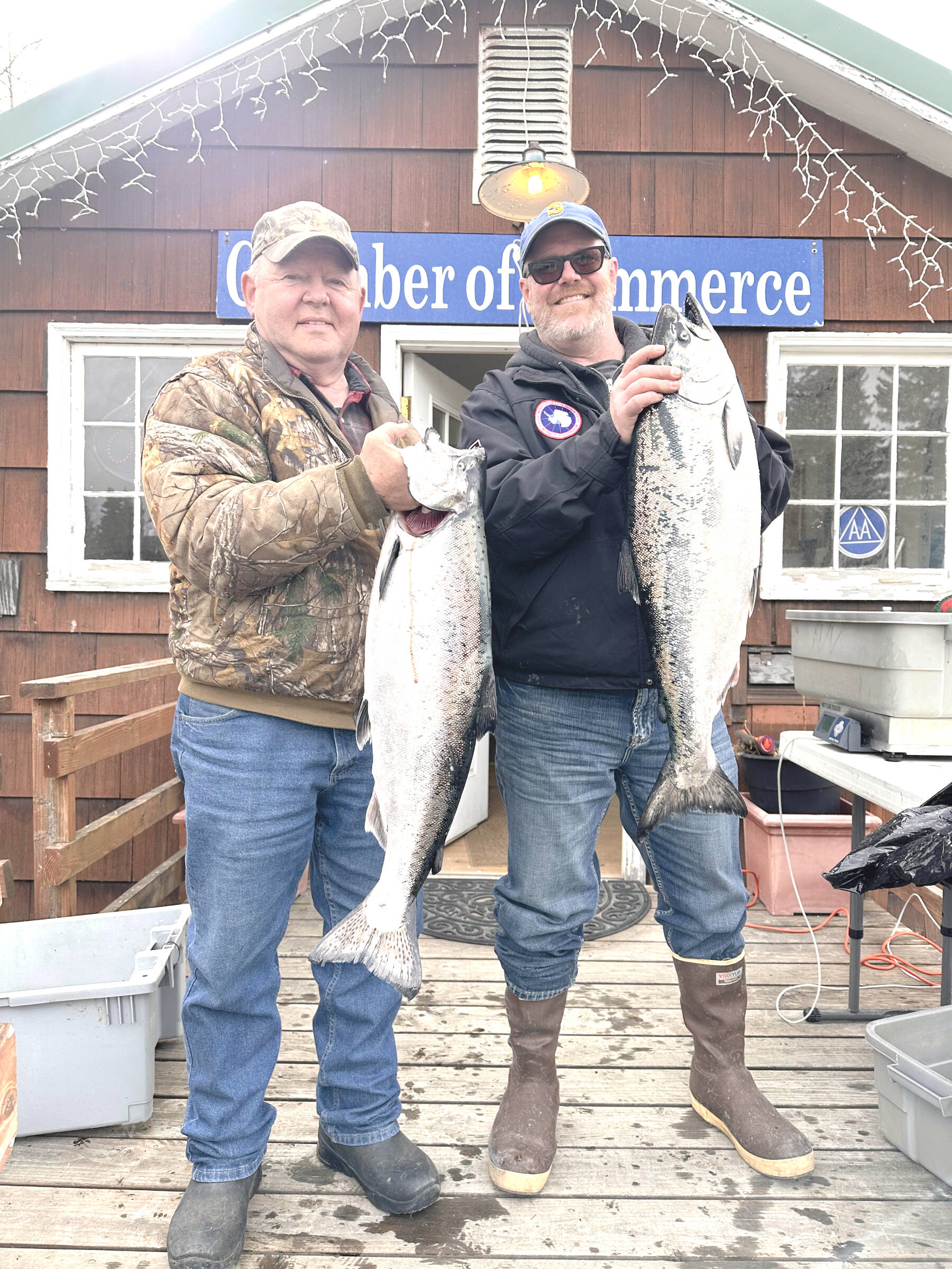 The 28th annual Anchor Point King Salmon Tournament third place winner, Joe Marx (right) holds up his fish during weigh-in on Saturday, May 6 at the Anchor Point Chamber of Commerce building in Anchor Point, Alaska. Photo courtesy of Mcki Needham