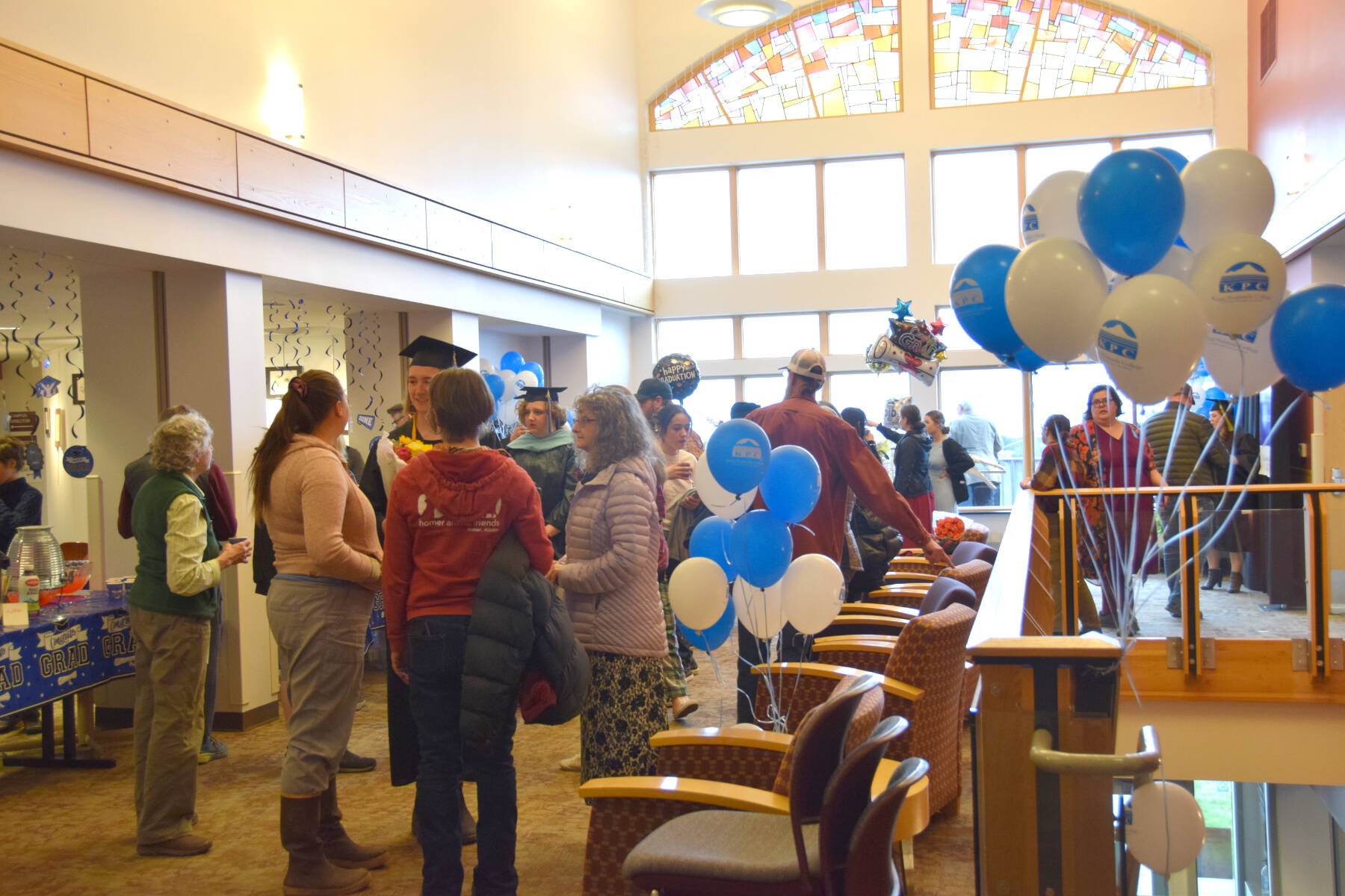 Kachemak Bay Campus graduates and their family members enjoy a reception gathering after the 2023 KBC Commencement on Wednesday, May 10, 2023, in Homer, Alaska. (Photo by Delcenia Cosman/Homer News)