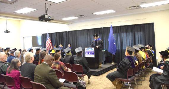 Kachemak Bay Campus Director Dr. Reid Brewer welcomes KBC graduates and audience members to the 2023 commencement ceremony on Wednesday, May 10, 2023, in Homer, Alaska. (Photo by Delcenia Cosman/Homer News)