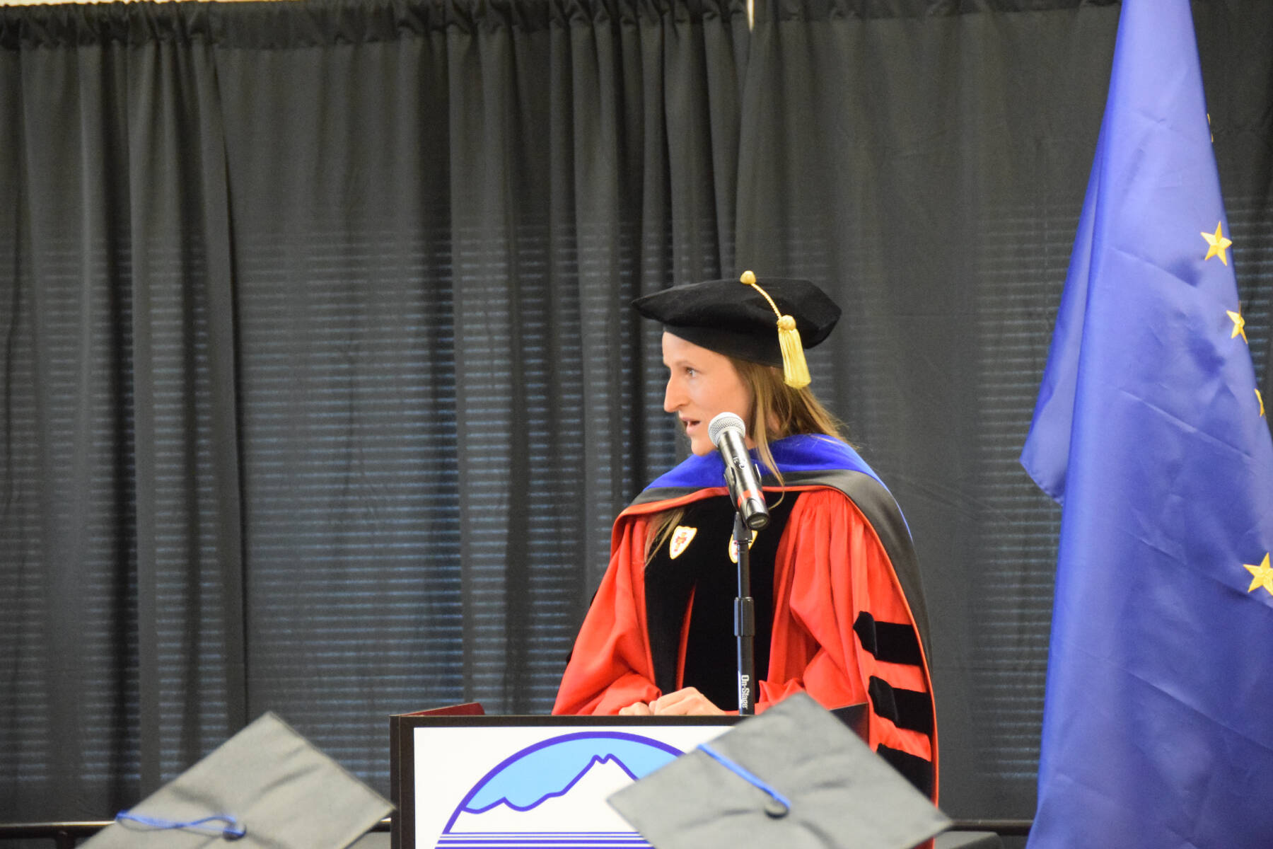Kachemak Bay Campus Associate Professor of English Dr. Lia Calhoun gives her faculty reflection address during the 2023 KBC Commencement on Wednesday, May 10, 2023, in Homer, Alaska. (Photo by Delcenia Cosman/Homer News)