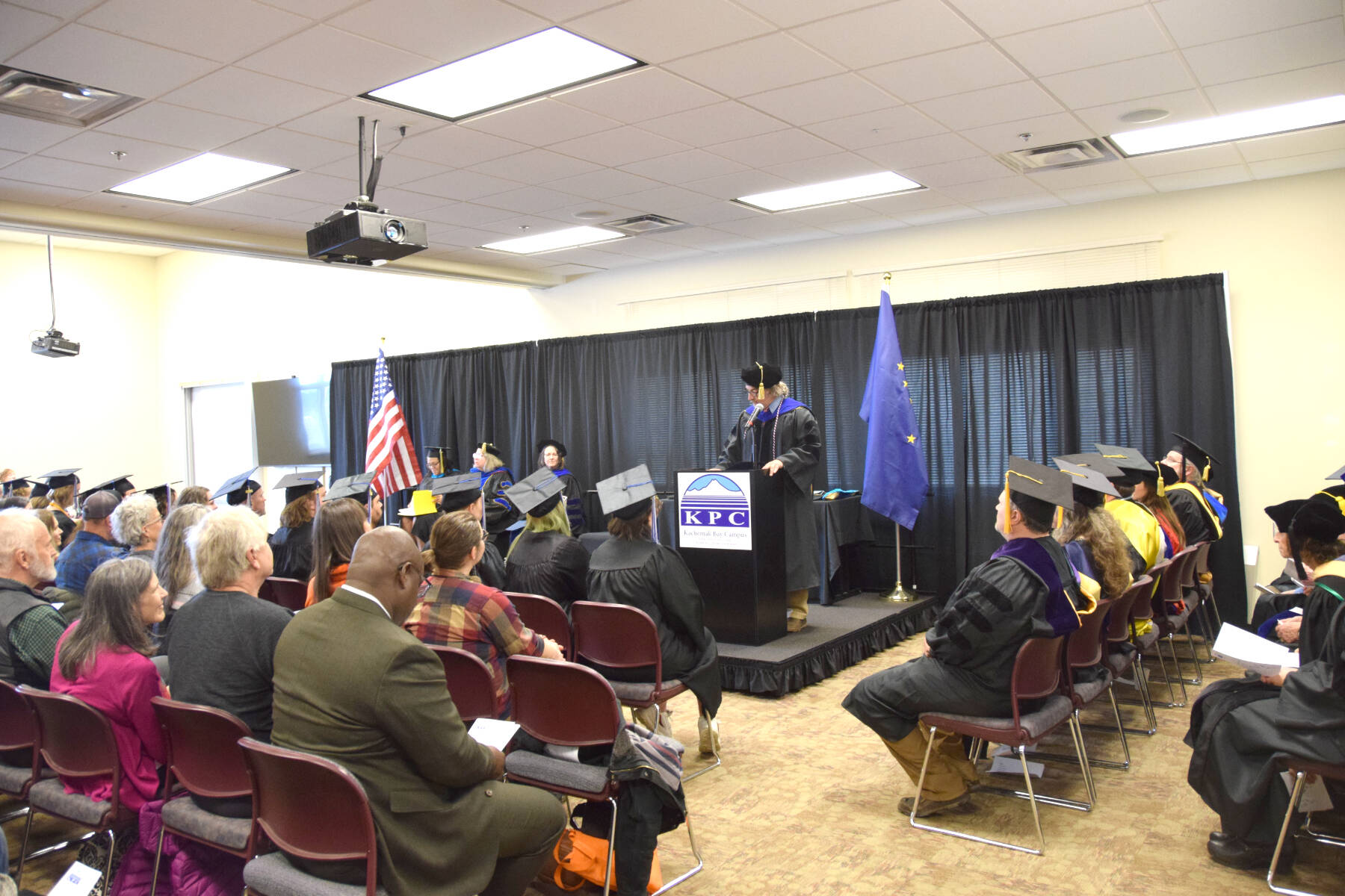 Kachemak Bay Campus Director Dr. Reid Brewer welcomes KBC graduates and audience members to the 2023 commencement ceremony on Wednesday, May 10, 2023, in Homer, Alaska. (Photo by Delcenia Cosman/Homer News)