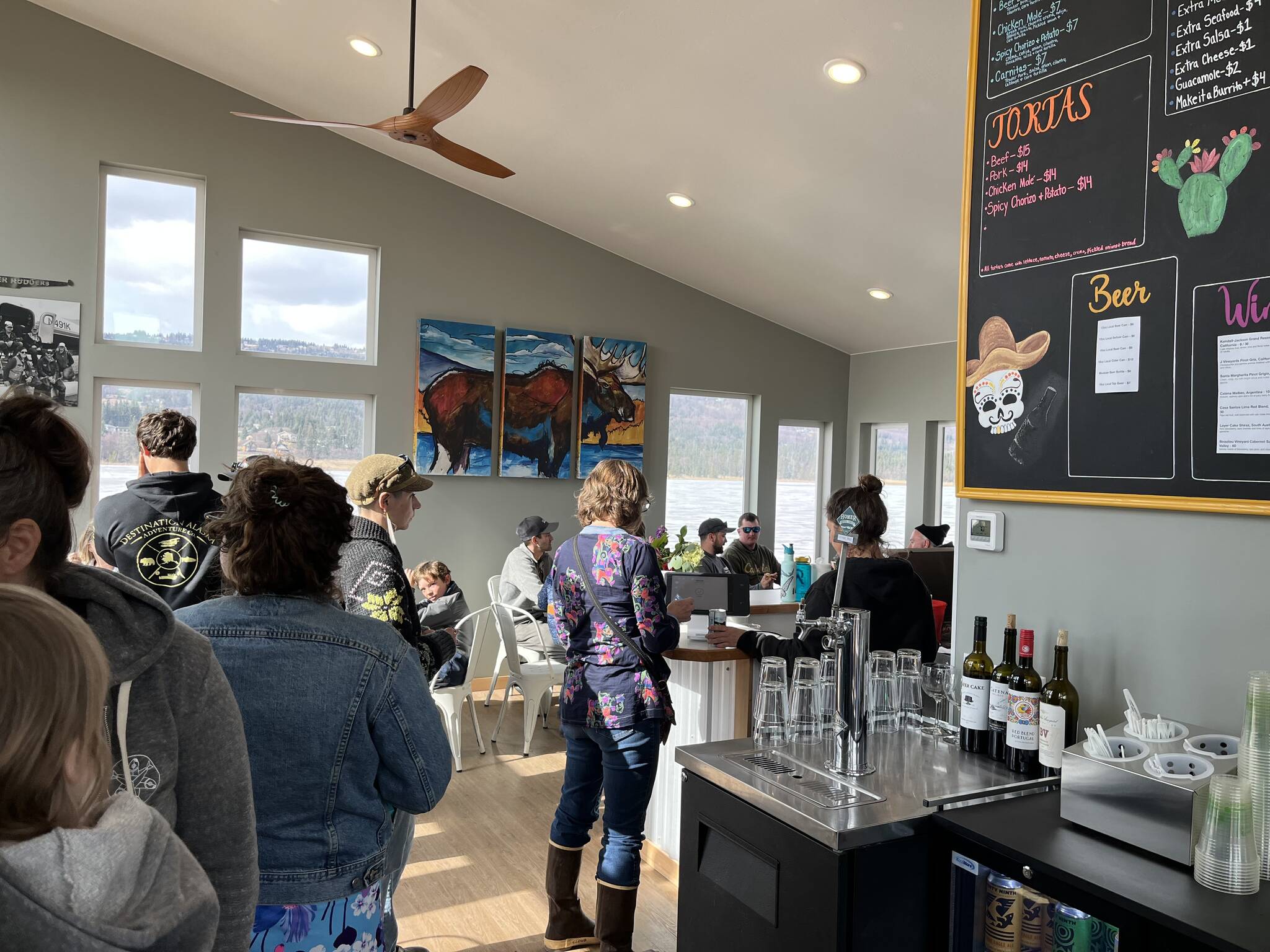 Community members and visitors enjoy opening day at The Tickled Pear restaurant, formerly a longtime Homer food truck, May 5, 2023. (Photo provided by Ashley Steiner)
