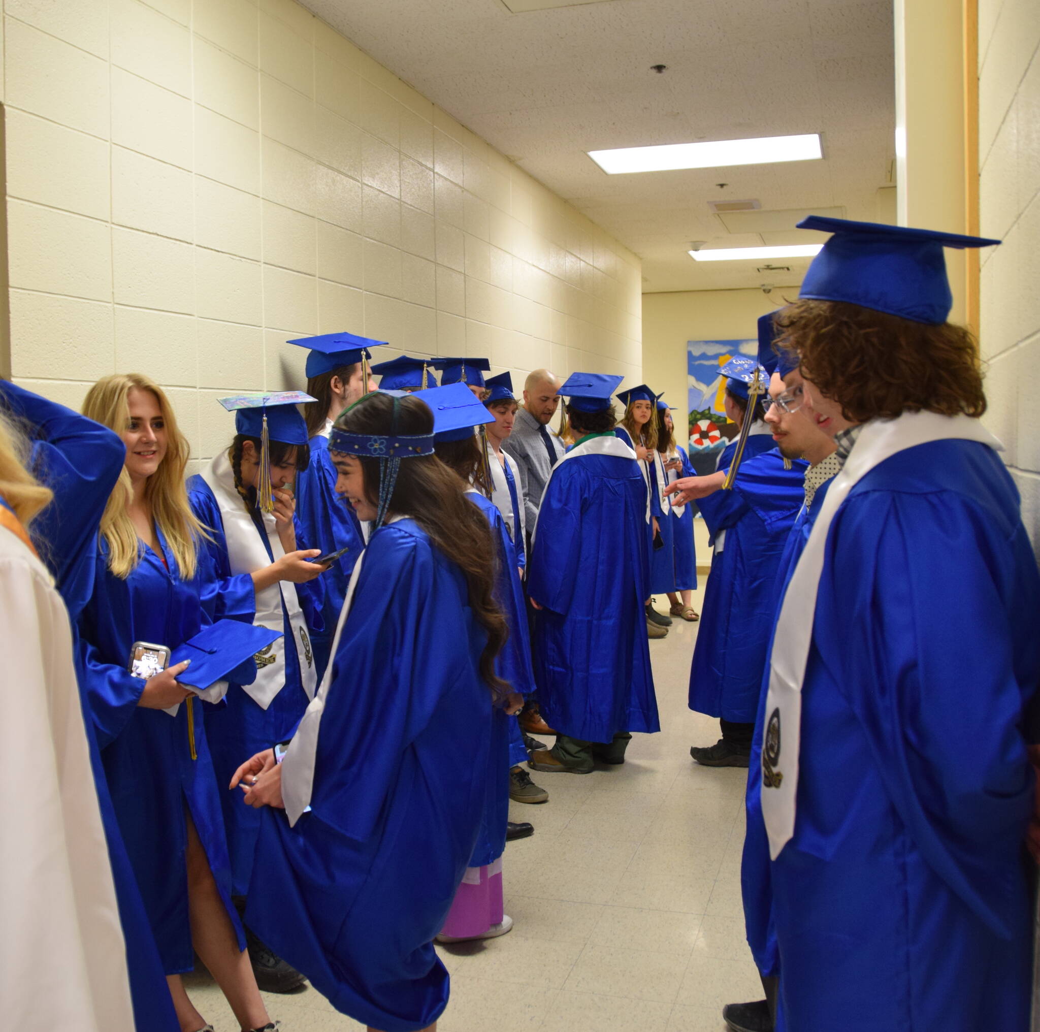 Homer High School graduating seniors gather in the school's hallway before the commencement ceremony, Monday, May 15, 2023, in Homer, Alaska. (Photo by Emilie Springer/ Homer News)