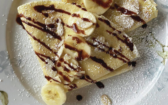 The simple yet versatile crepe can be served savory or sweet, such as this banana, powdered sugar and chocolate creation. (Photo by Tressa Dale/Peninsula Clarion)