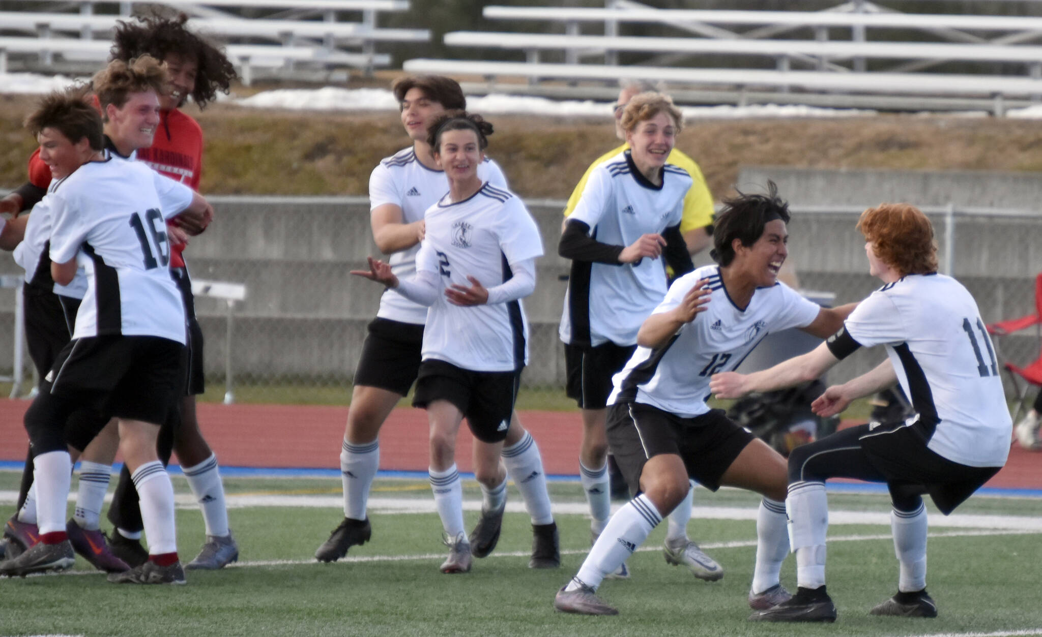 The Kenai Central boys soccer team celebrates victory Saturday, May 20, 2023, in the championship game of the Peninsula Conference tournament at Justin Maile Field at Soldotna High School in Soldotna, Alaska. (Photo by Jeff Helminiak/Peninsula Clarion)