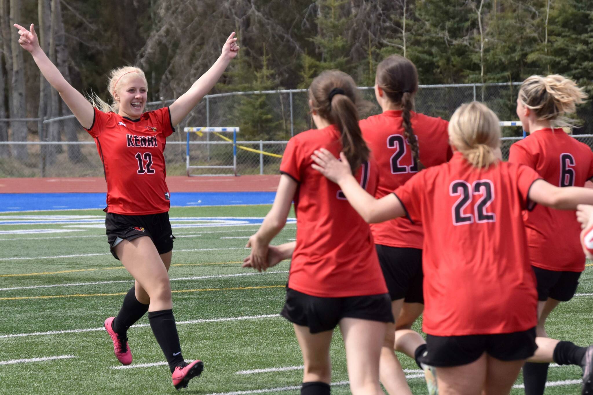 Kenai Central's Kate Wisnewski celebrates making the game-winning penalty kick on Saturday, May 20, 2023, in the championship game of the Peninsula Conference tournament at Justin Maile Field at Soldotna High School in Soldotna, Alaska. (Photo by Jeff Helminiak/Peninsula Clarion)