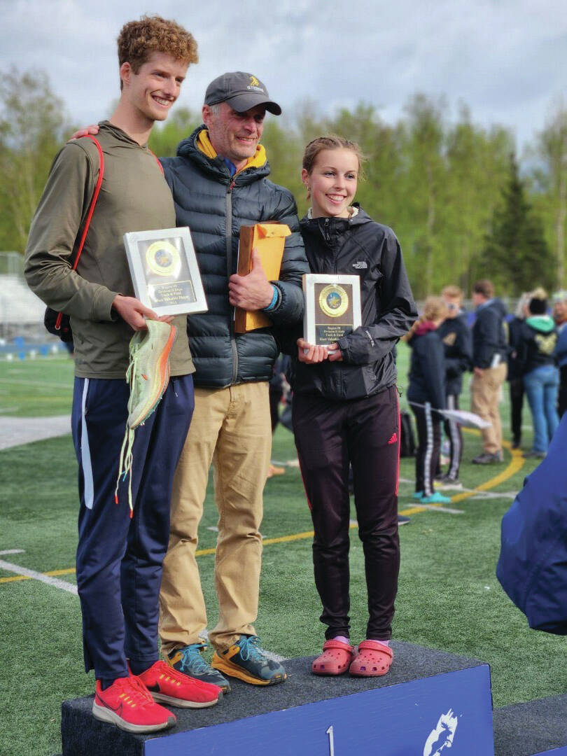 Region 3, Division 2 track awards are presented to Seamus McDonough, Coach Bob Ostrom, Eryn Field in Palmer on Saturday. (Photo provided by Kiirstin Styvar)