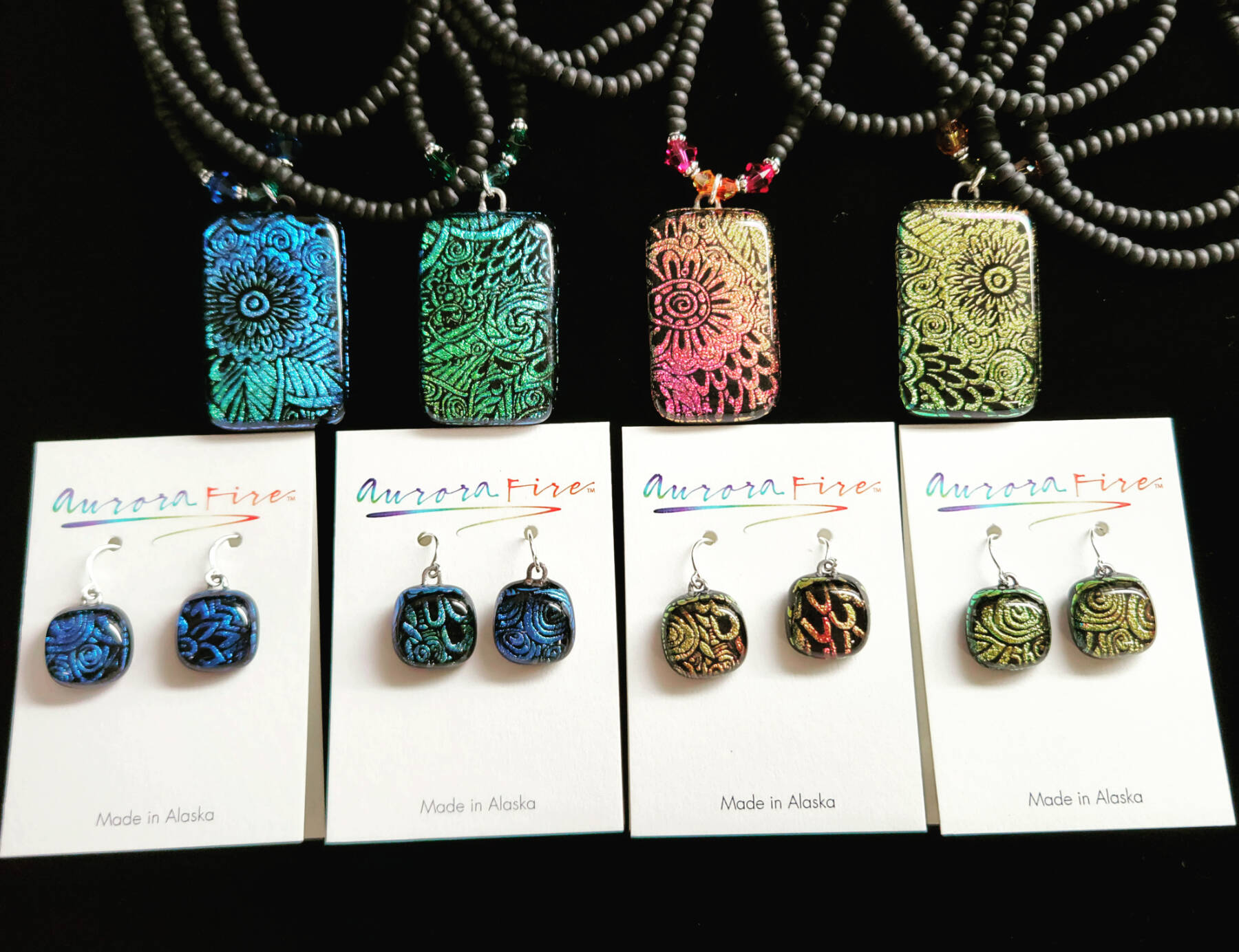 Dichroic jewelry by Liz Brown is featured at the Art Shop Gallery through June. Photo provided by the Art Shop Gallery