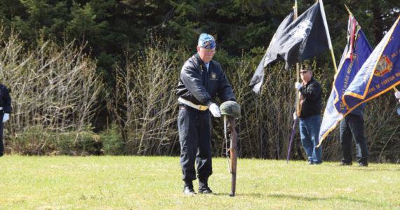 VFW Post 10221 member Eric Henley performs the battlefield cross during a Memorial Day service held at the Anchor Point Kallman Cemetery on Monday, May 29, 2023 in Anchor Point, Alaska. (Delcenia Cosman/Homer News)