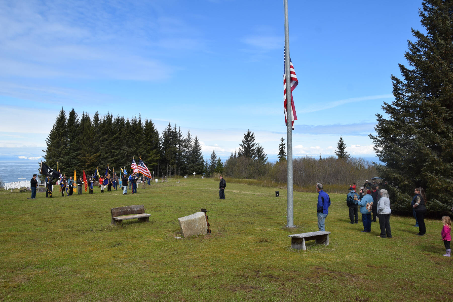 Community members attend a Memorial Day service hosted by VFW Post 10221 at the Anchor Point Kallman Cemetery on Monday, May 29, 2023 in Anchor Point, Alaska. (Delcenia Cosman/Homer News)