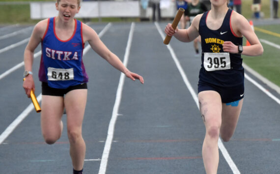 Homer’s Eryn Field holds off Sitka’s Clare Mullin to win the Division II 1,600-meter relay Saturday, May 27, 2023, at the state track and field meet at Palmer High School in Palmer, Alaska.