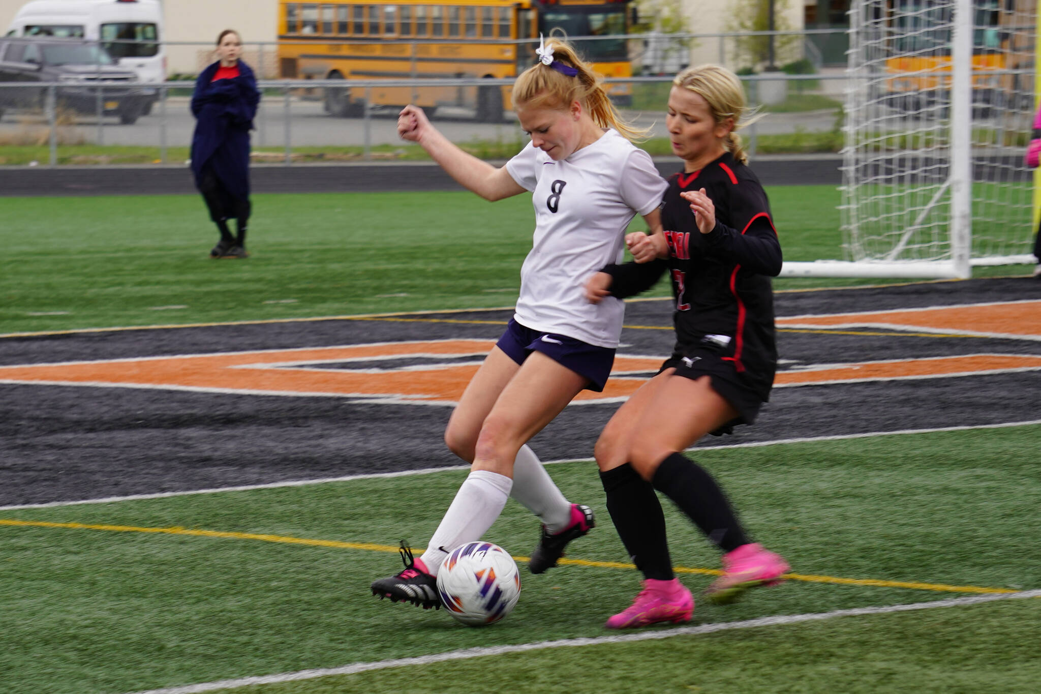 Soldotna’s Keely Sundberg battles for the ball with Kenai Central’s Kate Wisnewski during the Division II Soccer State Championship on Saturday, May 27, 2023, at West Anchorage High School in Anchorage, Alaska. (Jake Dye/Peninsula Clarion)