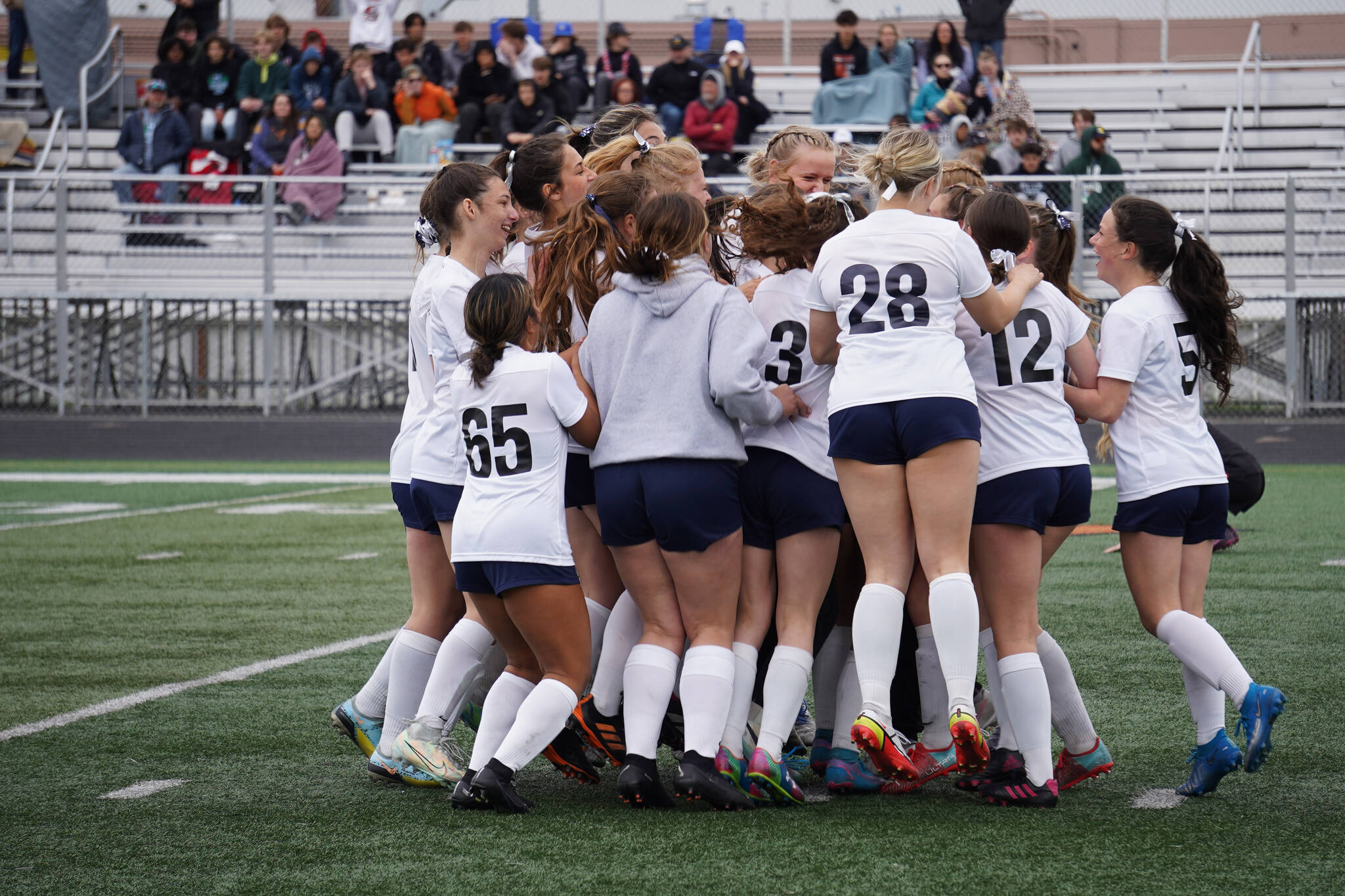 The Soldotna Stars celebrate after winning the Division II Soccer State Championship on Saturday, May 27, 2023, at West Anchorage High School in Anchorage, Alaska. (Jake Dye/Peninsula Clarion)