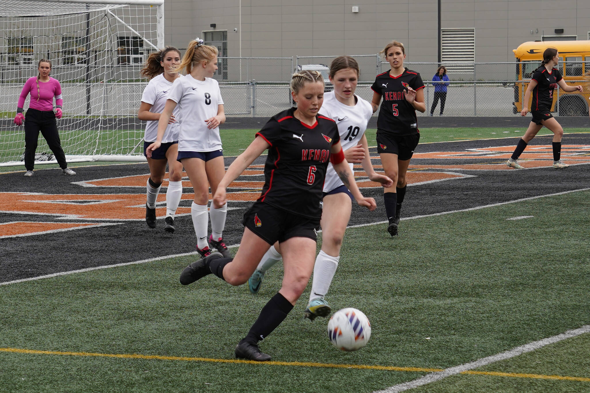 Kenai Central’s Kori Moore races after the ball closely pursued by Soldotna’s Anika Jedlicka during the Division II Soccer State Championship on Saturday, May 27, 2023, at West Anchorage High School in Anchorage, Alaska. (Jake Dye/Peninsula Clarion)