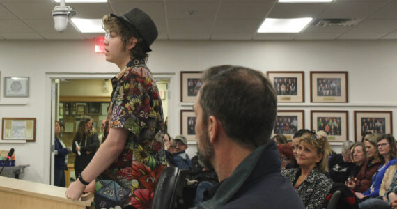 Soldotna High School senior Josiah Burton testifies in opposition to a proposed cut of Kenai Peninsula Borough School District theater technicians while audience members look on during a board of education meeting on Monday, March 6, 2023, in Soldotna, Alaska. (Ashlyn O’Hara/Peninsula Clarion)