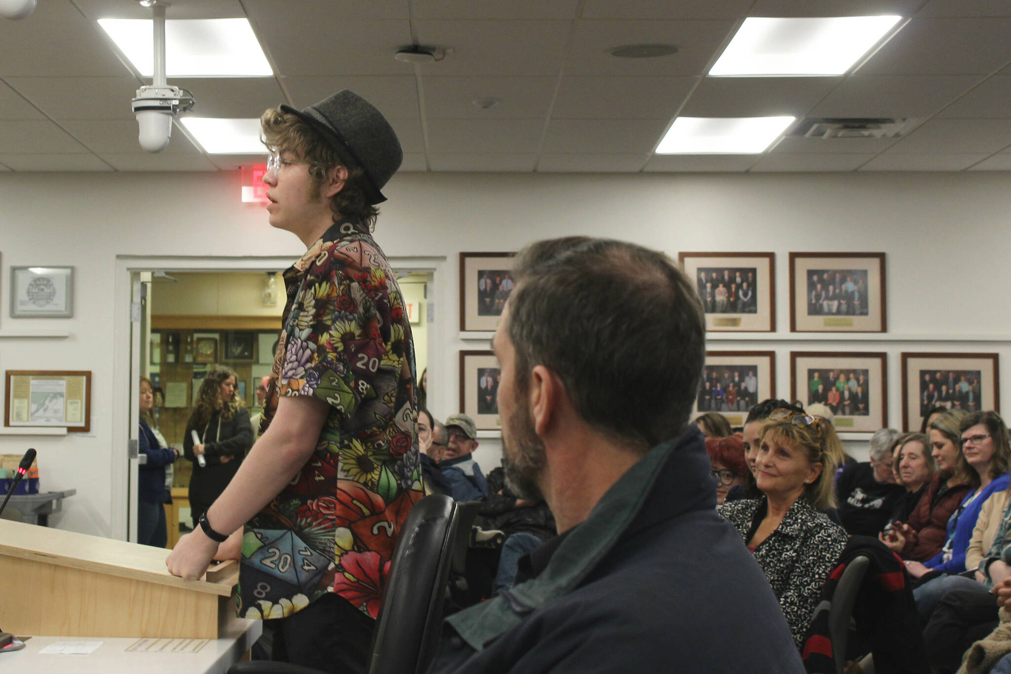 Soldotna High School senior Josiah Burton testifies in opposition to a proposed cut of Kenai Peninsula Borough School District theater technicians while audience members look on during a board of education meeting on Monday, March 6, 2023, in Soldotna, Alaska. (Ashlyn O’Hara/Peninsula Clarion)