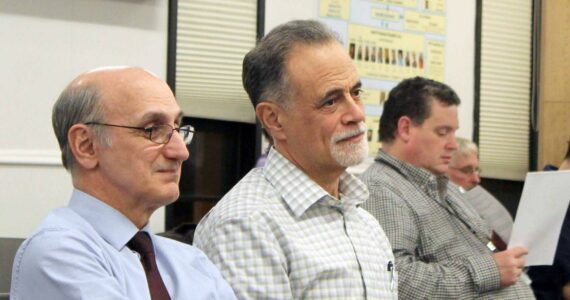 Peter Micciche (center) listens to the Kenai Peninsula Borough Assembly certify the results of the Feb. 14, 2023, special mayoral election, through which he was elected mayor of the Kenai Peninsula Borough, on Tuesday, Feb. 21, 2023 in Soldotna, Alaska. (Ashlyn O’Hara/Peninsula Clarion)