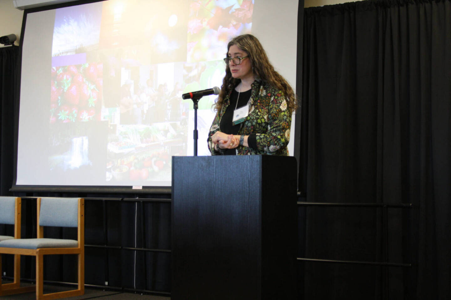 Erin Coughlin Hollowell, in her role as conference director, welcomes Kachemak Bay Writers’ Conference attendees and faculty on Saturday, May 13, 2023 at Kachemak Bay Campus in Homer, Alaska. (Delcenia Cosman/Homer News)