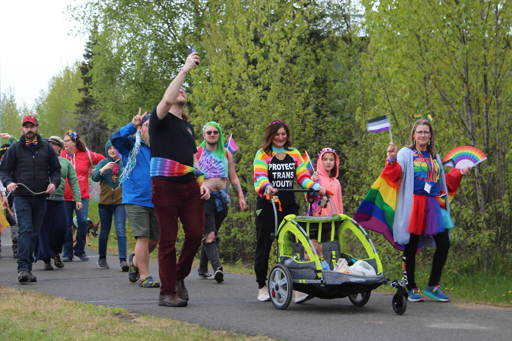 Michele Vasquez (right) helps lead marchers from the Soldotna Regional Sports Complex to Soldotna Creek Park as part of Soldotna Pride in the Park on Saturday, June 3, 2023 in Soldotna, Alaska. (Ashlyn O’Hara/Peninsula Clarion)