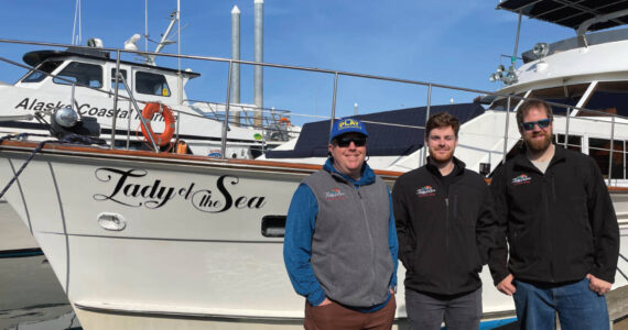 Second captain Mike Tozzo, chef Avram Salzman, and captain and owner Rand Seaton pose in front of the “Lady of the Sea” on Thursday, June 1, 2023 in the Homer Harbor in Homer, Alaska. Photo provided by Lauren Seaton