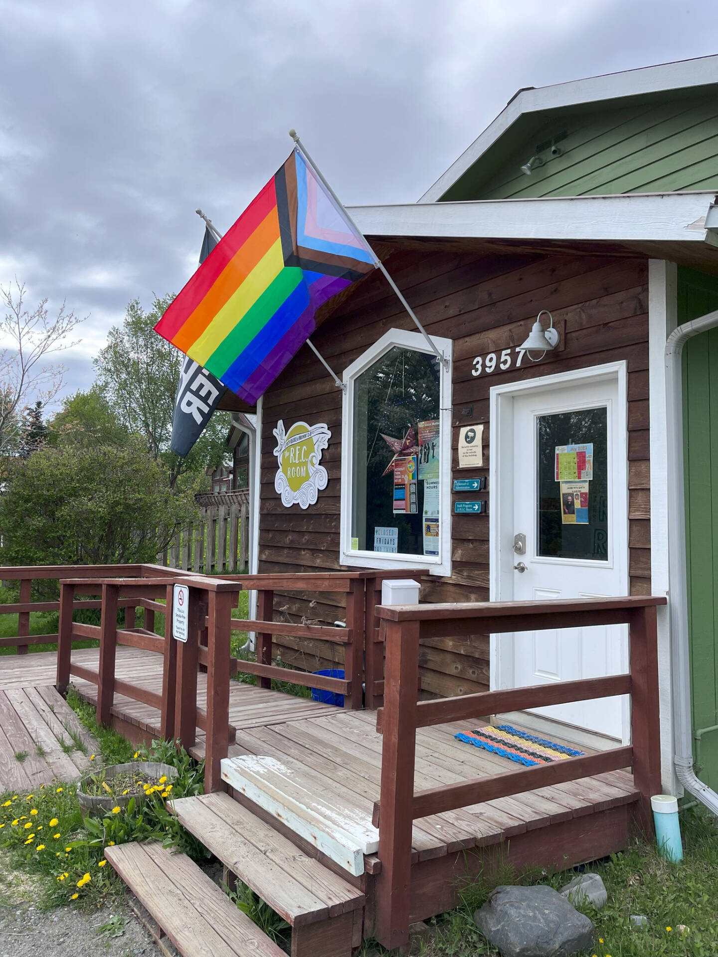 The newly-replaced Pride flags hang in front of the REC Room entrance in June 2023 in Homer, Alaska. Photo by the REC Room