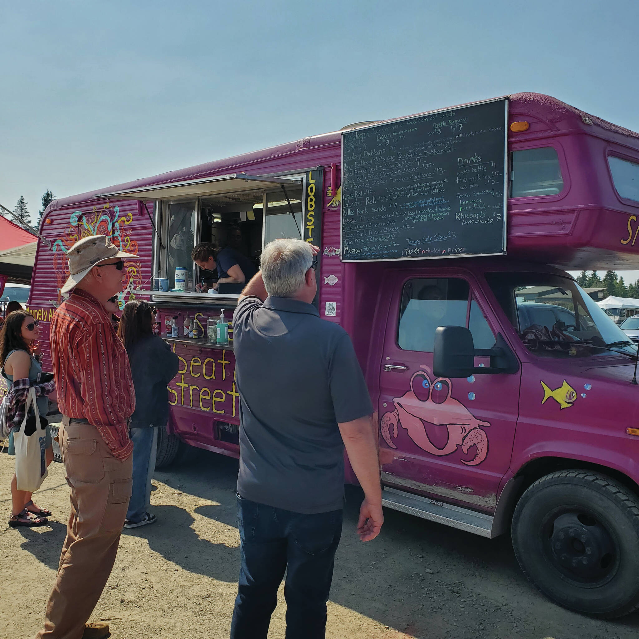A food vendor serves customers during the 2022 Concert on the Lawn held at the Down East Saloon. (Photo provided by Josh Krohn, KBBI)