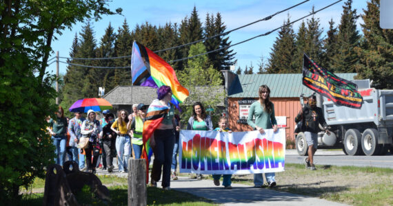 Homer community members parade down Pioneer Avenue on their way to the Liberation Celebration at WKFL Park hosted by Homer Pride on Saturday, June 17, 2023 in Homer Alaska. (Delcenia Cosman/Homer News)