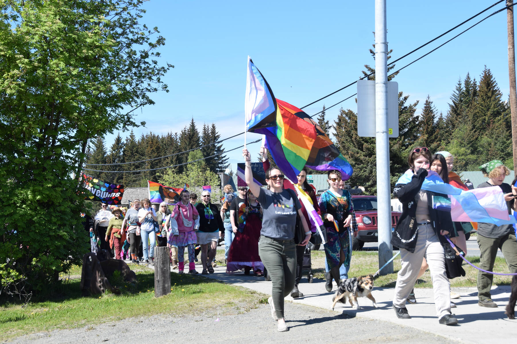 Homer community members parade down Pioneer Avenue on their way to the Liberation Celebration at WKFL Park hosted by Homer Pride on Saturday, June 17, 2023 in Homer Alaska. (Delcenia Cosman/Homer News)