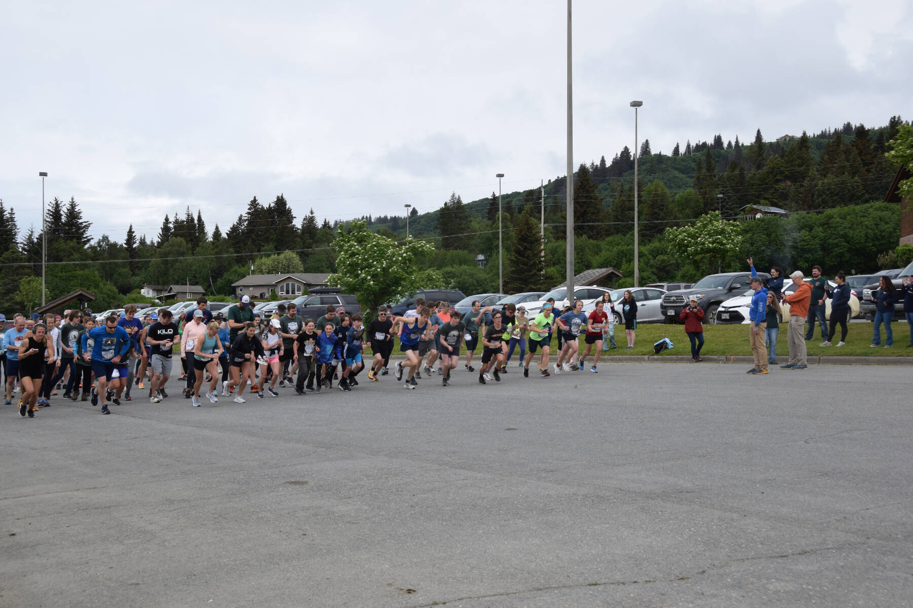 Runners participating in the Homer Spit Run 10K to the Bay race take off with the firing of the starter’s gun at Homer High School on Saturday, June 24, 2023 in Homer, Alaska. (Delcenia Cosman/Homer News)