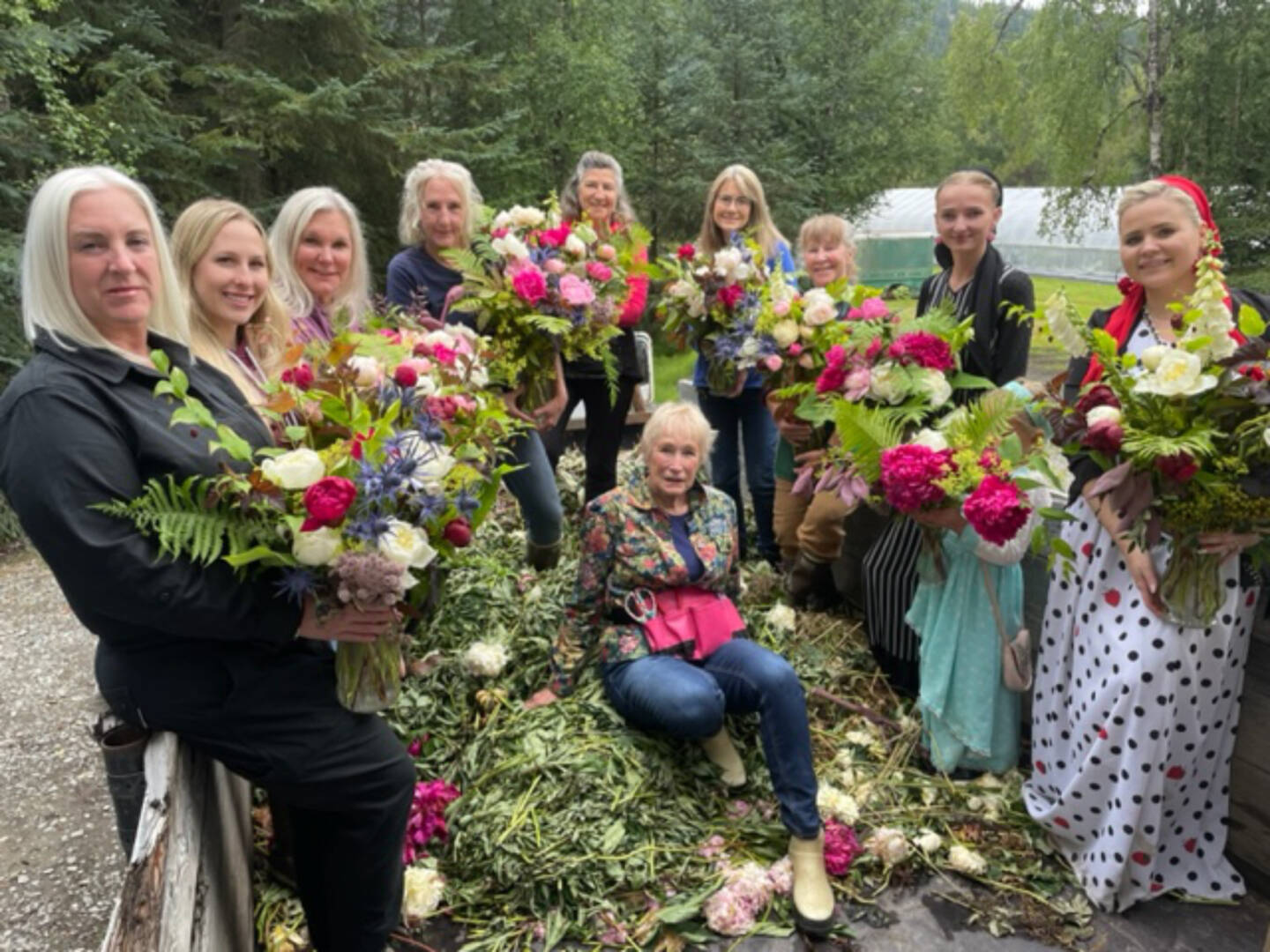 Community members and visitors are photographed after a bouquet-making class with peony farmer Rita Jo Schultz during the Homer Peony Celebration in the summer of 2022. Photo courtesy of Rita Jo Schoultz