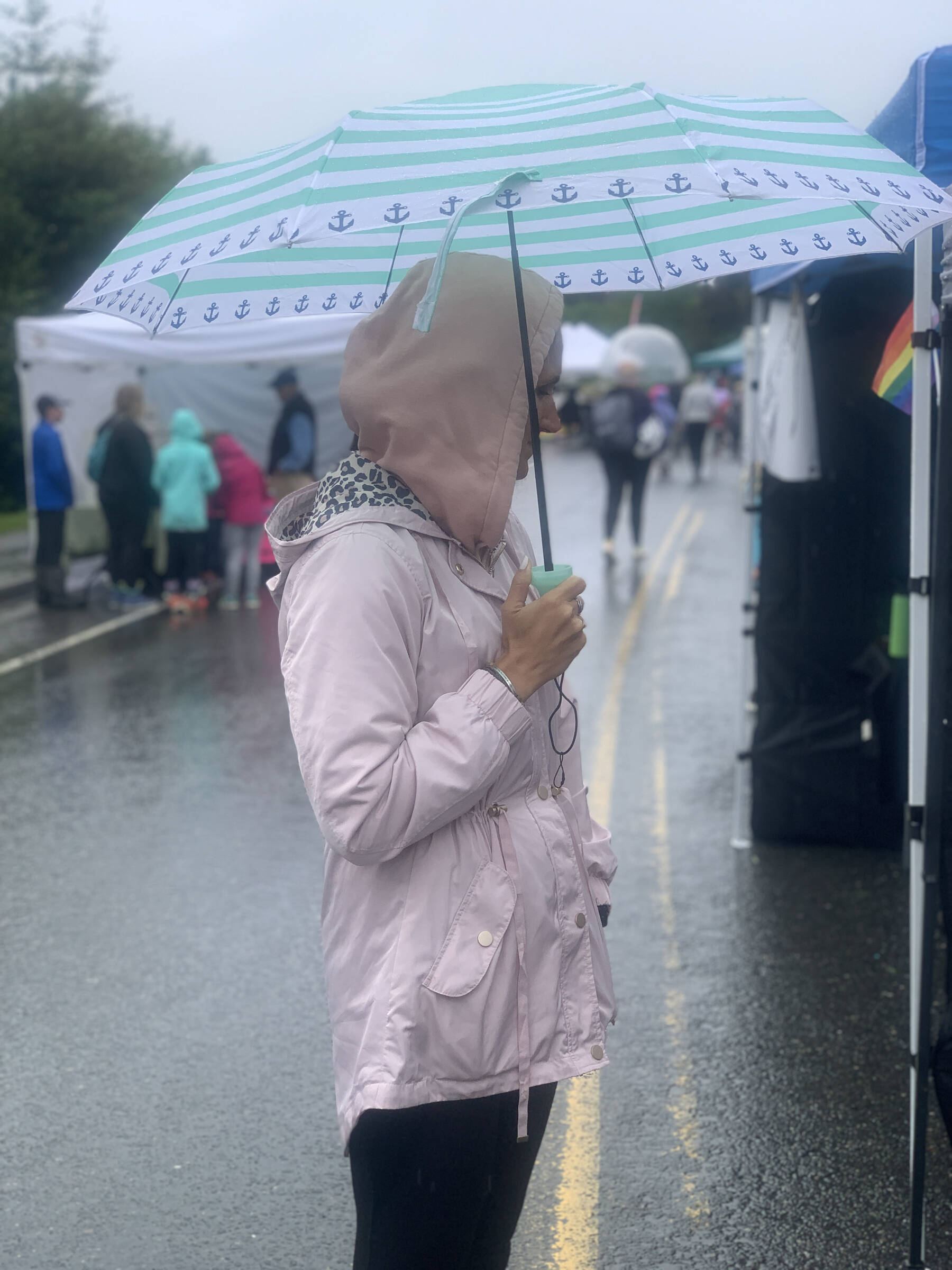 Rainy conditions didn’t keep people away from enjoying the first annual Summer Solstice Fair held on Wednesday, June 21, 2023 between Safeway and the Homer Public Library in Homer, Alaska. Photo by Christina Whiting