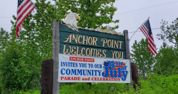 A banner inviting the community to Anchor Point's annual Fourth of July celebrations is posted by the Sterling Highway heading south on Saturday, June 24, 2023 in Anchor Point, Alaska. (Delcenia Cosman/Homer News)