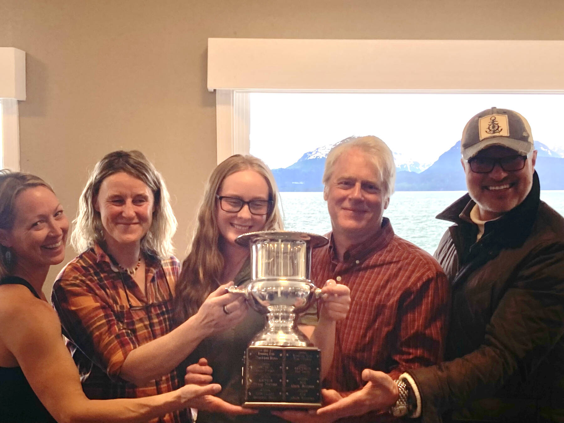 Erik Pullman (fourth from left), winner of the 2023 Homer Yacht Club Land’s End Regatta, is photographed during the awards ceremony at Land’s End Resort on Sunday, June 25, 2023 in Homer, Alaska. Photo courtesy of Laurie Gentle