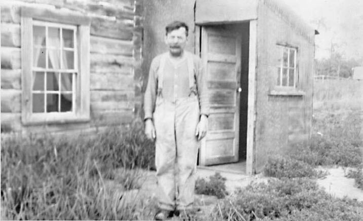 Windy Wagner poses in front of his cabin at Mile 6 of the Kenai River in this undated photo from the Knackstedt Collection.