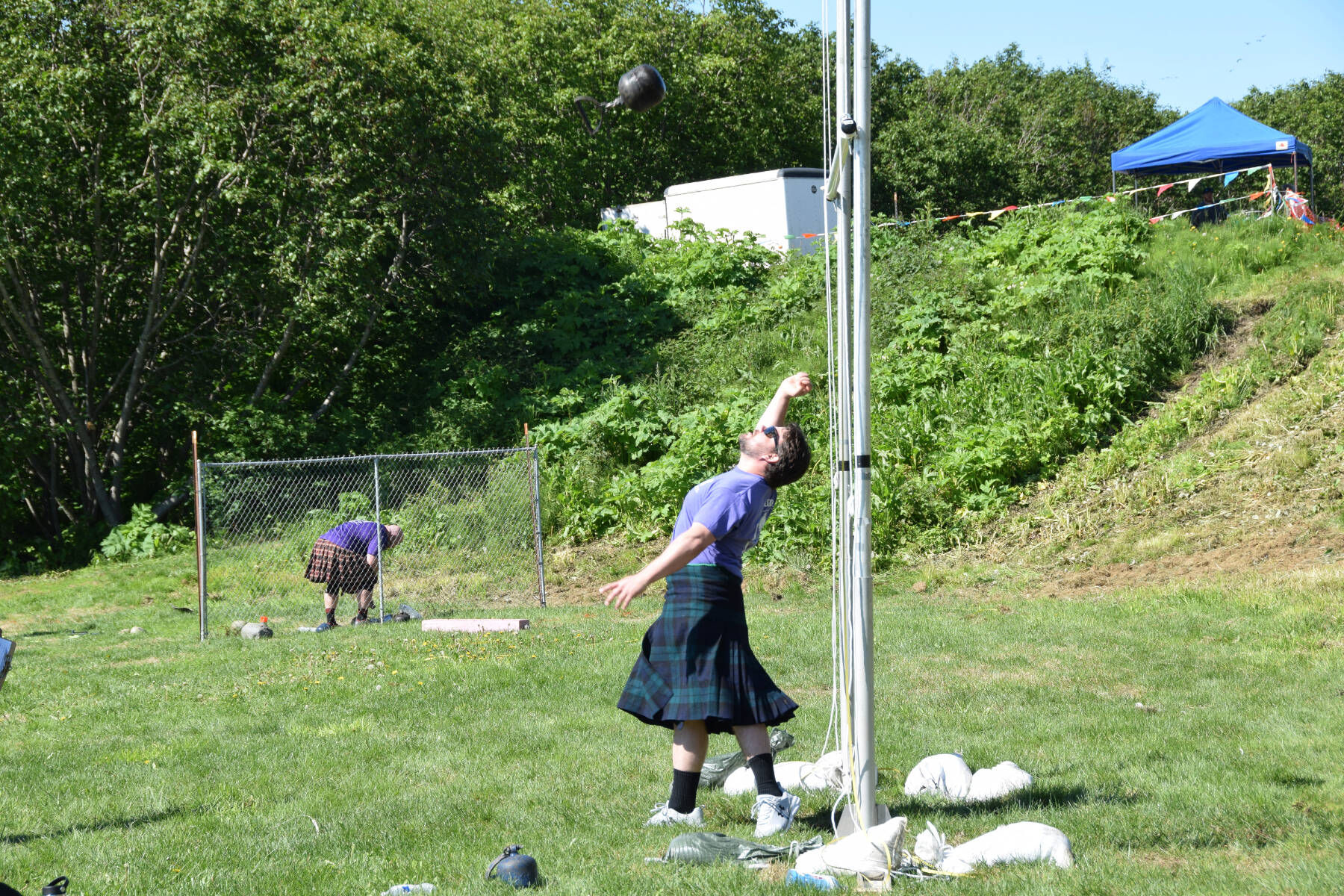 Nick Pyfer participates in the Weight Over the Bar event during the Kachemak Bay Highland Games on Saturday, July 1, 2023 at Karen Hornaday Park in Homer, Alaska. (Delcenia Cosman/Homer News)