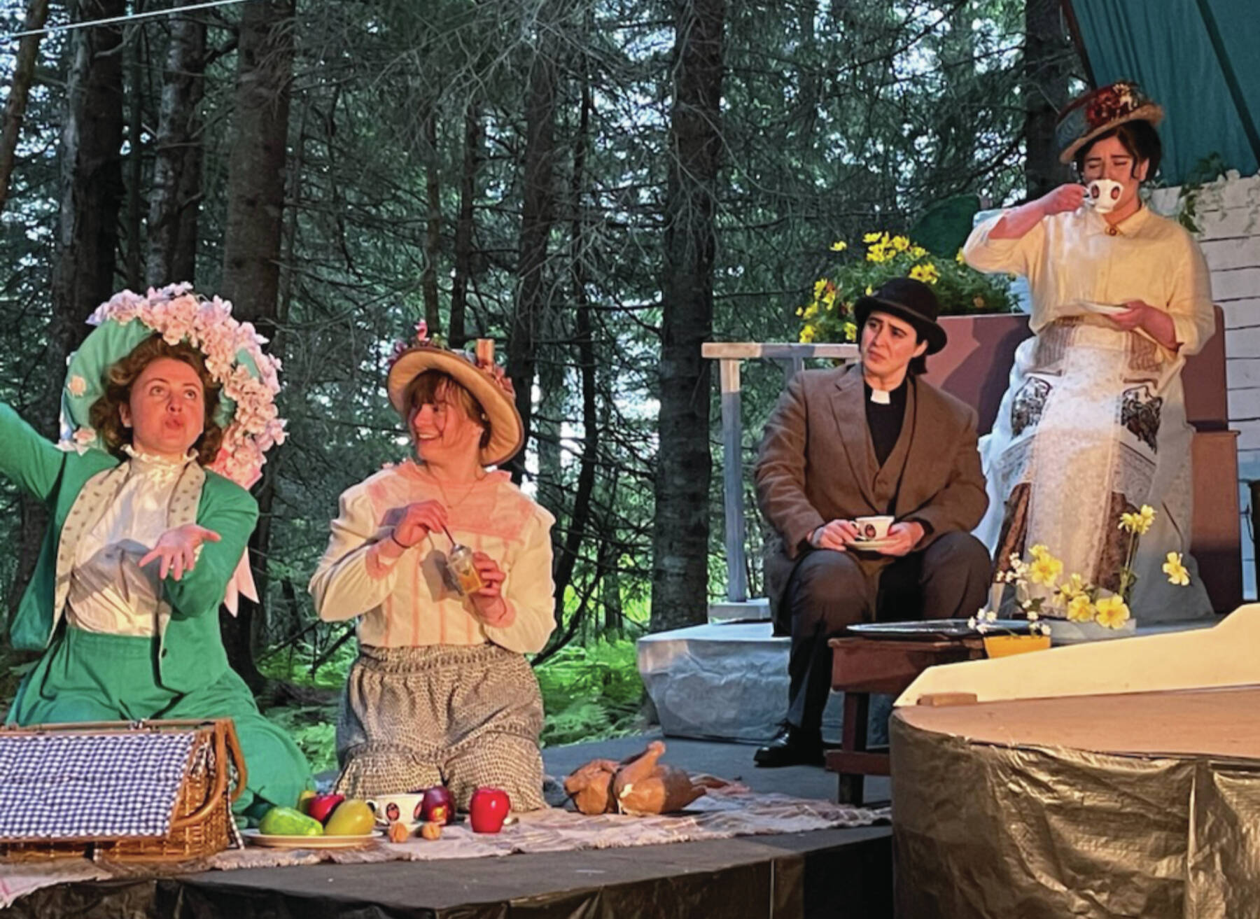 Mebahiah Eller, Katia Holmes, Regi Johanos and Cristen San Roman perform in “Maud of the Island” on the Pratt Museum’s forest stage in Homer on June 29.